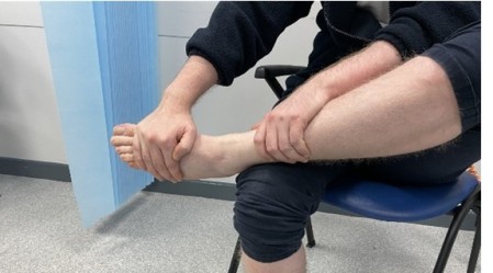 GEH-5028-2-2025 Image 6 Left foot across right knee